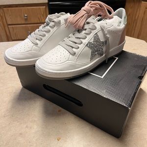 The Shu Shop brand tennis shoes